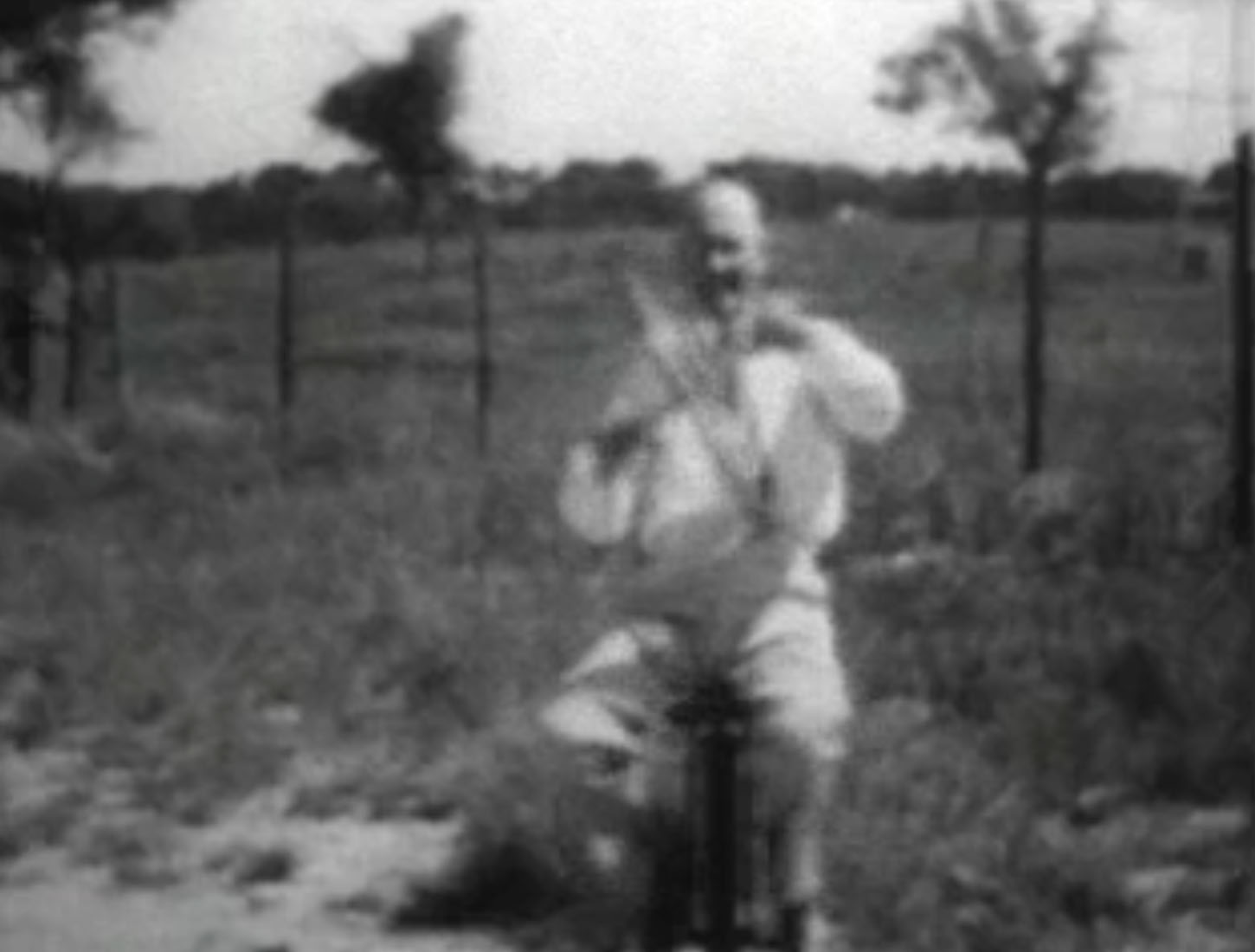Robert Goddard, smiling as he demonstrates the principle of the gyroscope in order to convince the patent office of the legitimacy of his claims